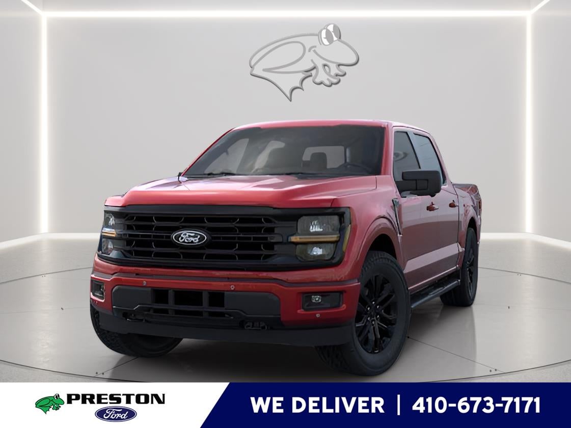 2026 Ford F-150 XLT in Ruby Red Metallic Tinted Clearcoat — front three-quarter view