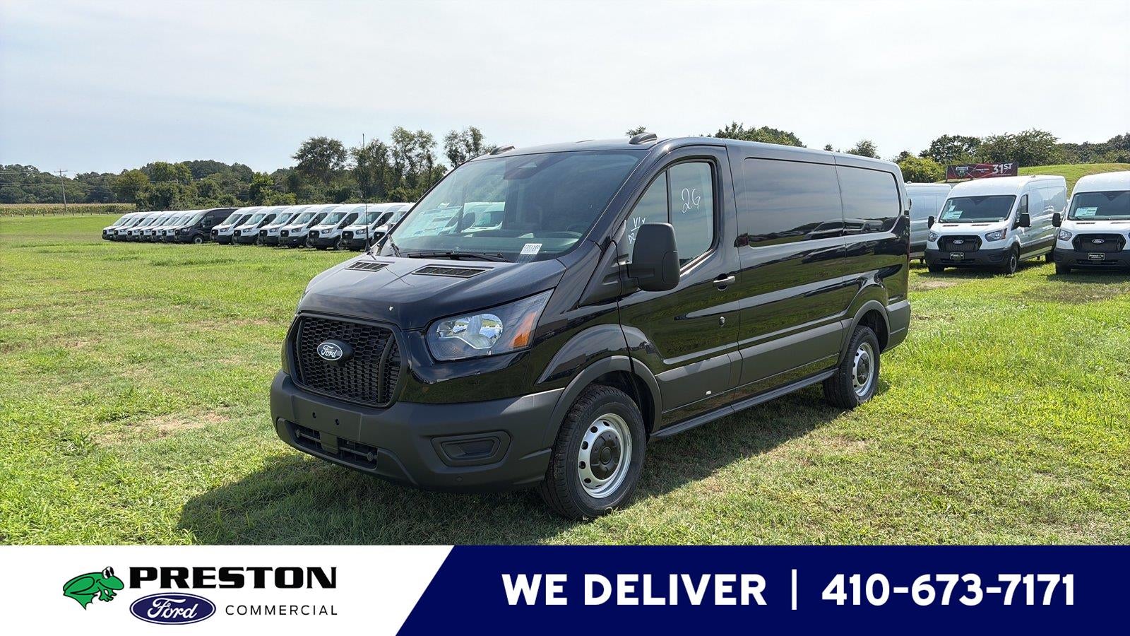 2026 Ford Transit Cargo Van T-150 130" Low Rf 8800 GVWR RWD in Agate Black Metallic — front three-quarter view