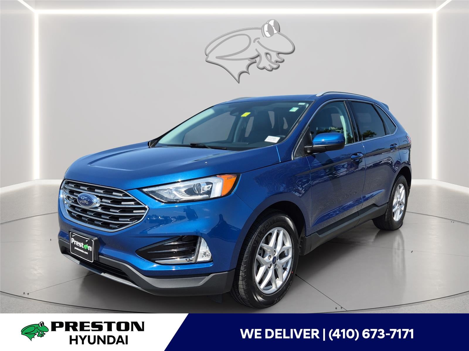 2021 Ford Edge SEL in Atlas Blue — front three-quarter view